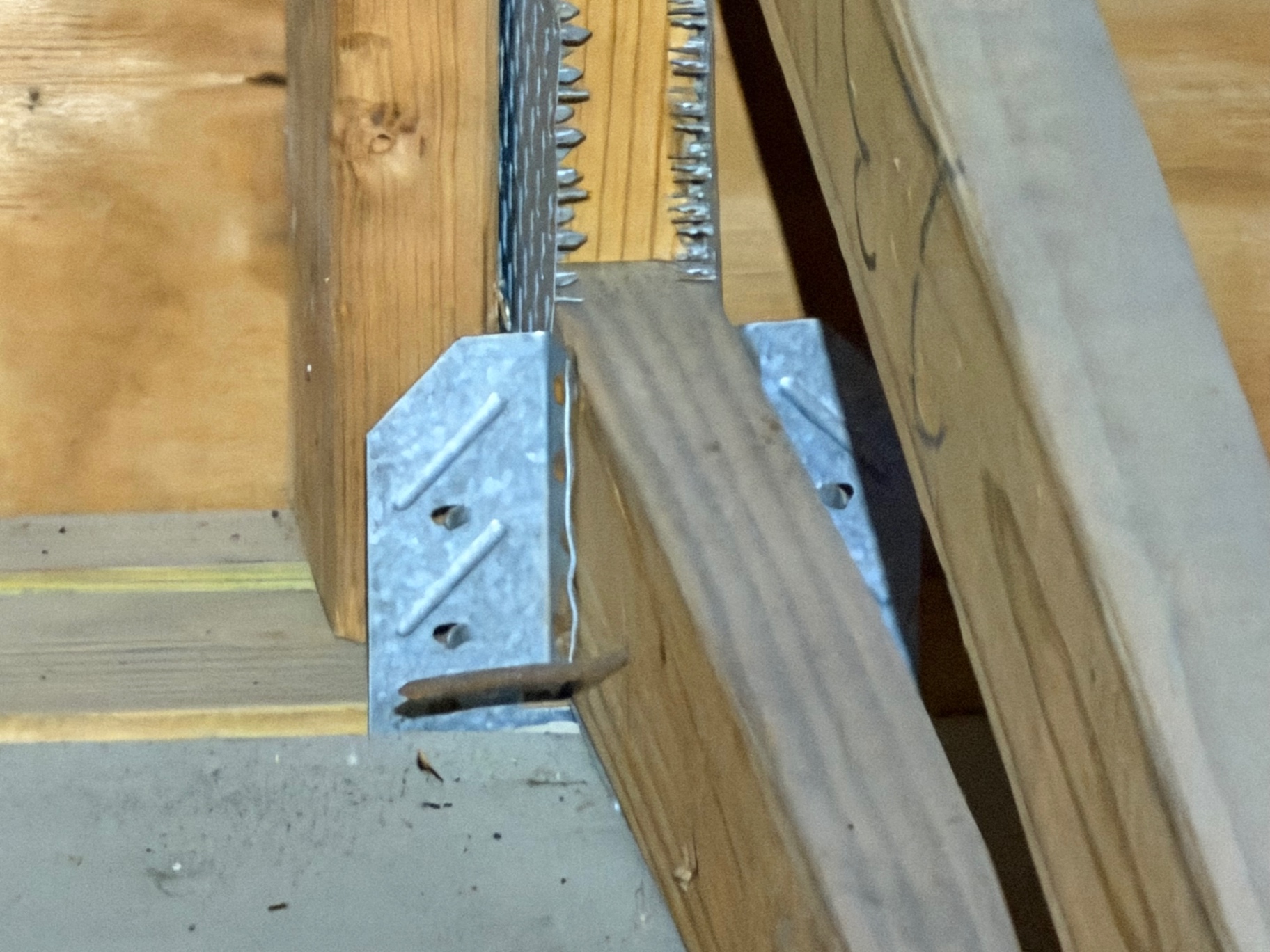 Truss connector plate documented in attic for wind mitigation