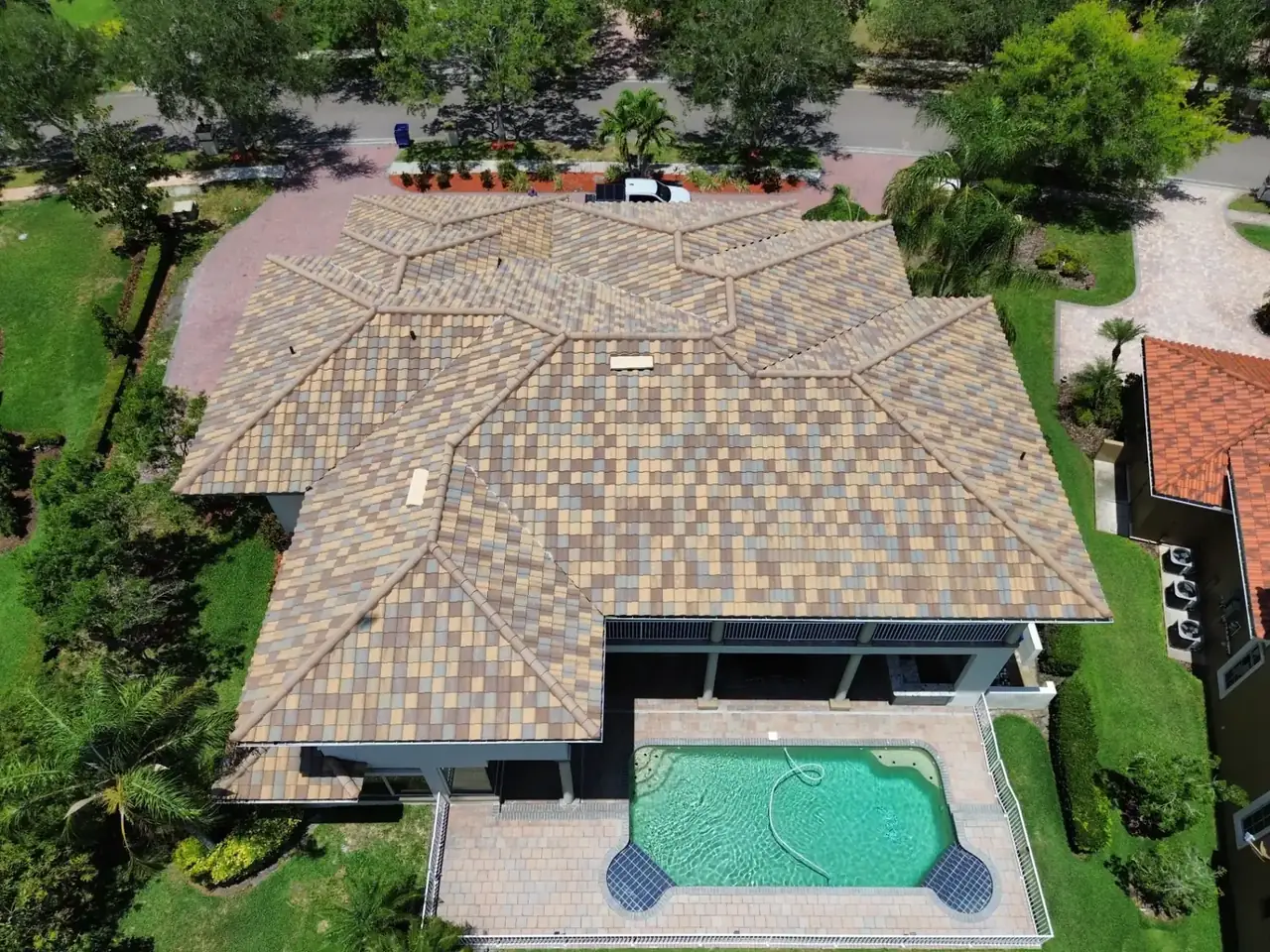 Aerial drone view of a Florida home with tile roof