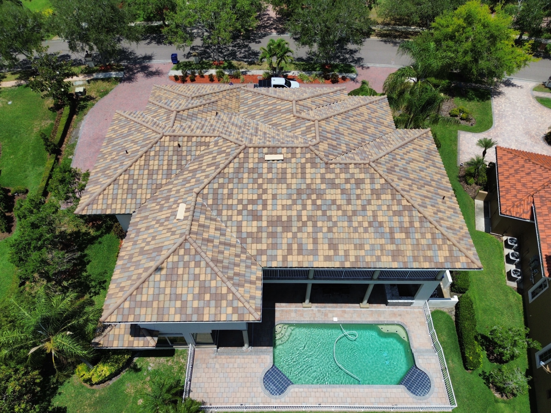 Aerial drone view of a Florida home with tile roof